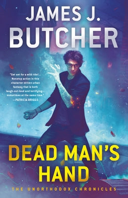 Paperback copy of Dead Man's Hand by Ace Books, featuring the book's cover with dark-themed artwork and title text.