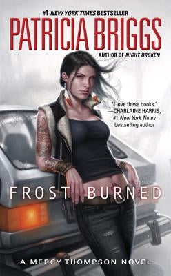Frost Burned paperback novel by Ace Books, featuring a dark, icy cover with a winter landscape and snowy scenery.