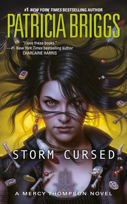 Paperback of Storm Cursed by Ace Books, featuring the book cover with dark and mystical artwork.