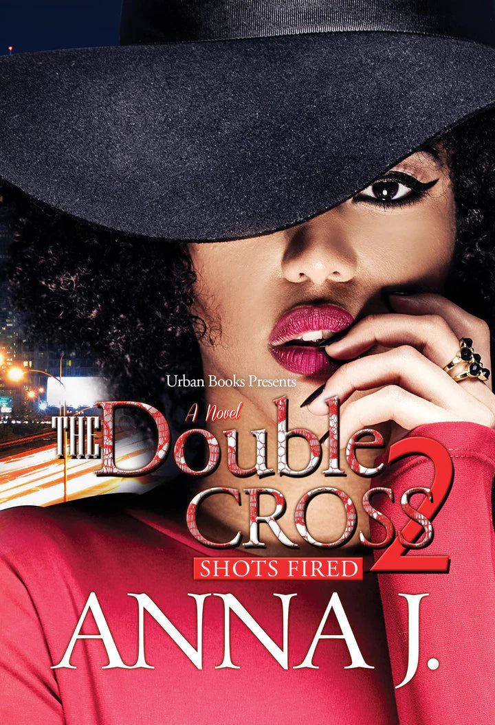 Paperback copy of The Double Cross 2 by Anna J, featuring the book cover with title and author's name.
