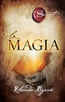 Paperback copy of the novel Magia by Atria Books, featuring the book's cover with vibrant artwork and title text.