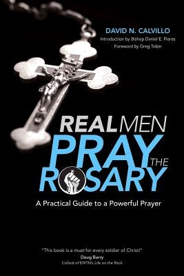 Paperback book titled "Real Men Pray the Rosary" by Ave Maria Press, featuring a cover with religious imagery and title text.