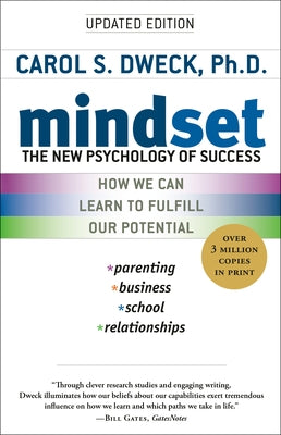 Paperback copy of "Mindset: The New Psychology of Success" by Ballantine Books, featuring the book cover with title and author.