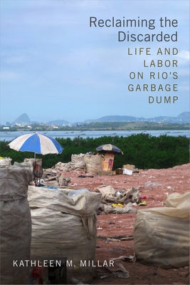 Paperback book "Reclaiming the Discarded" by Duke University Press, featuring a cover image related to Rio's garbage dump.