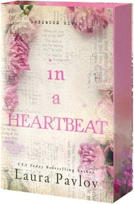 Paperback of "In a Heartbeat" by Entangled: Amara, featuring the book cover with a heart-themed design.