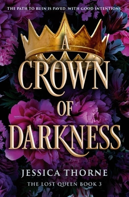 Paperback copy of "A Crown of Darkness" by Forever, featuring the book cover with dark, mystical artwork and title text.
