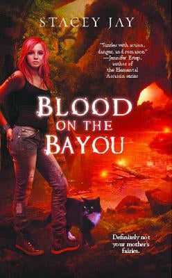 Paperback copy of Blood on the Bayou by Gallery Books, showing the book cover with dark, mysterious imagery.