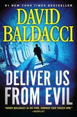 Paperback copy of "Deliver Us from Evil" by Grand Central Publishing, featuring the book's cover with title and author.