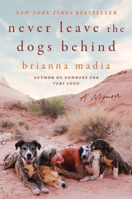 Paperback of "Never Leave the Dogs Behind: A Memoir" by HarperOne, featuring the book cover with title and author details.