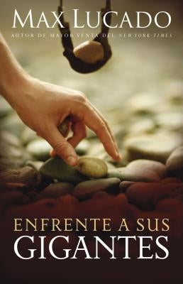 Paperback of "Enfrente a Sus Gigantes" by Grupo Nelson, featuring a cover with inspiring imagery and bold typography.