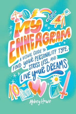 Paperback of "My Enneagram," a visual guide to understanding personality types, placed on a wooden surface with colorful illustrations.