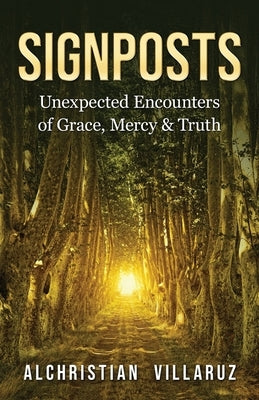 Paperback book "Signposts: Unexpected Encounters of Grace, Mercy & Truth" by Orison Publishers, Inc. on a wooden table.