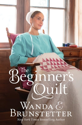 Paperback copy of The Beginner's Quilt novel by Barbour Fiction, featuring a colorful cover design and soft paper pages.