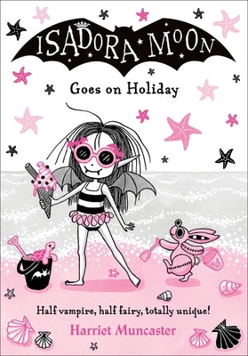 Paperback copy of Isadora Moon Goes on Holiday, Volume 11 by Oxford Children's, featuring colorful cover art with Isadora Moon character.