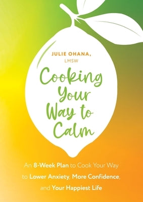 Paperback cookbook titled "Cooking Your Way to Calm" by Sheldon Press, featuring a cozy kitchen scene with ingredients and utensils.
