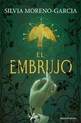 Paperback horror novel "El Embrujo" by Planeta Publishing, featuring dark cover art with eerie illustrations.