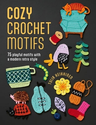 Open paperback book titled Cozy Crochet Motifs by David & Charles, displaying colorful crochet motif illustrations on the cover.