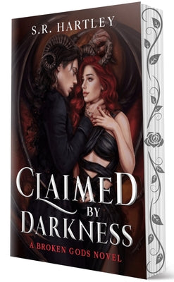 Paperback copy of "Claimed by Darkness" by City Owl Press, featuring the book's dark-themed cover art.