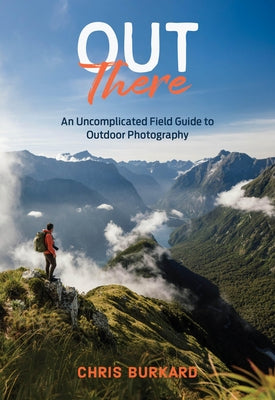 Paperback copy of "Out There: An Uncomplicated Field Guide to Outdoor Photography" by Chronicle Books, featuring outdoor scenes on the cover.