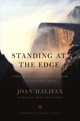 Paperback of "Standing at the Edge: Finding Freedom Where Fear and Courage Meet" by Flatiron Books, with a cover featuring a person on a cliff edge.