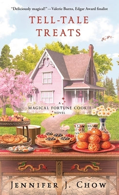 Mass market paperbound of Tell-Tale Treats: A Magical Fortune Cookie Novel by Minotaur Books, featuring a colorful book cover.