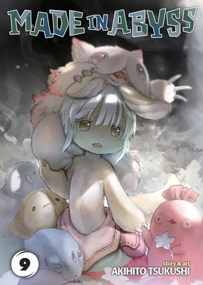 Paperback copy of Made in Abyss Vol. 9 manga by Seven Seas featuring colorful cover art and detailed illustration.