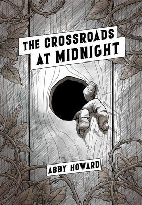 Paperback of "The Crossroads at Midnight" comic book by Iron Circus Comics, featuring cover art with dark, atmospheric imagery.