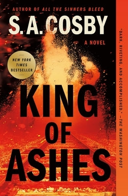 Paperback of King of Ashes by Flatiron Books: Pine & Cedar, showing the book cover with dark flames and ash imagery.