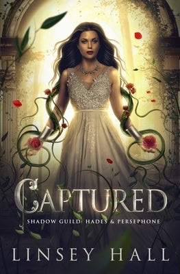 Paperback copy of the book "Captured" by Independently Published, featuring a plain cover with text.