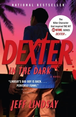Paperback copy of "Dexter in the Dark" by Knopf Doubleday Publishing Group, featuring the book's cover with dark and mysterious artwork.