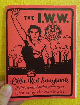 Paperback of I.W.W. Little Red Songbook, Nineteenth Edition from 1923, featuring classic hits, published by Microcosm Publishing.