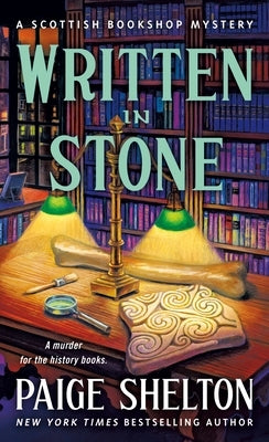 Mass market paperback of "Written in Stone: A Scottish Bookshop Mystery" by Minotaur Books, featuring a cover with Scottish scenery.