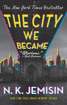 Paperback copy of "The City We Became" by Orbit, featuring the book's cover with cityscape artwork and title text.