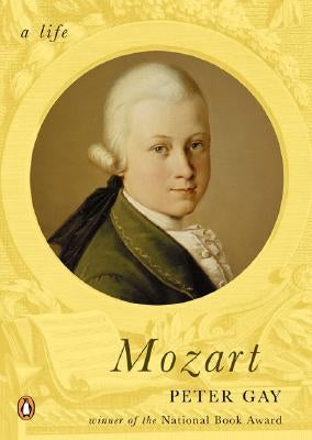 Paperback of Mozart: A Life by Penguin Books, featuring a close-up of the book cover with elegant design elements.