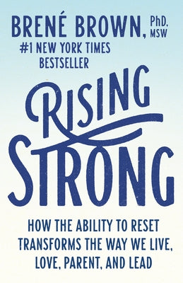 Paperback of Rising Strong book by Random House showing the cover with title about resilience and personal transformation.