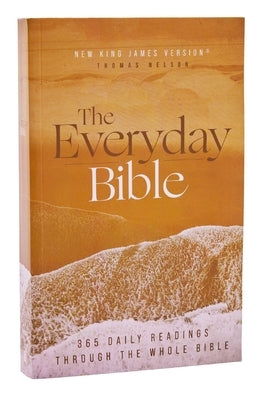 Red paperback Nkjv The Everyday Bible by Thomas Nelson with red letter text and comfort print, open to daily readings.