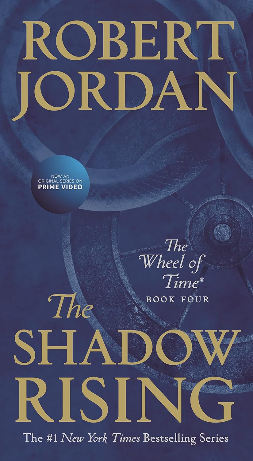 Paperback copy of "The Shadow Rising," Book Four of The Wheel of Time by Tor Fantasy, with cover art visible.