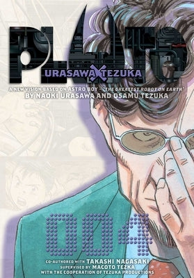 Paperback of Pluto: Urasawa X Tezuka, Vol. 4 manga by Viz Media, featuring cover art with Japanese artwork and title text.