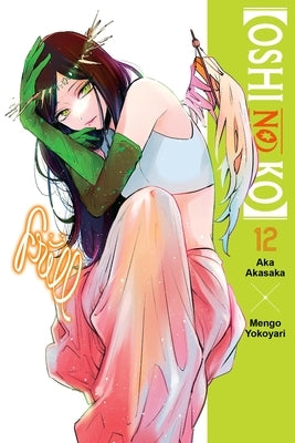 Paperback of Oshi No Ko, Vol. 12 by Yen Press, featuring the cover art with colorful manga illustrations.
