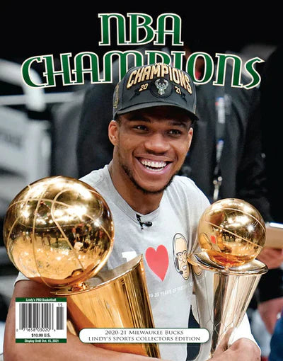 Sports magazine featuring the Milwaukee Bucks NBA Champions 2020-21 cover with vibrant team graphics and player imagery.