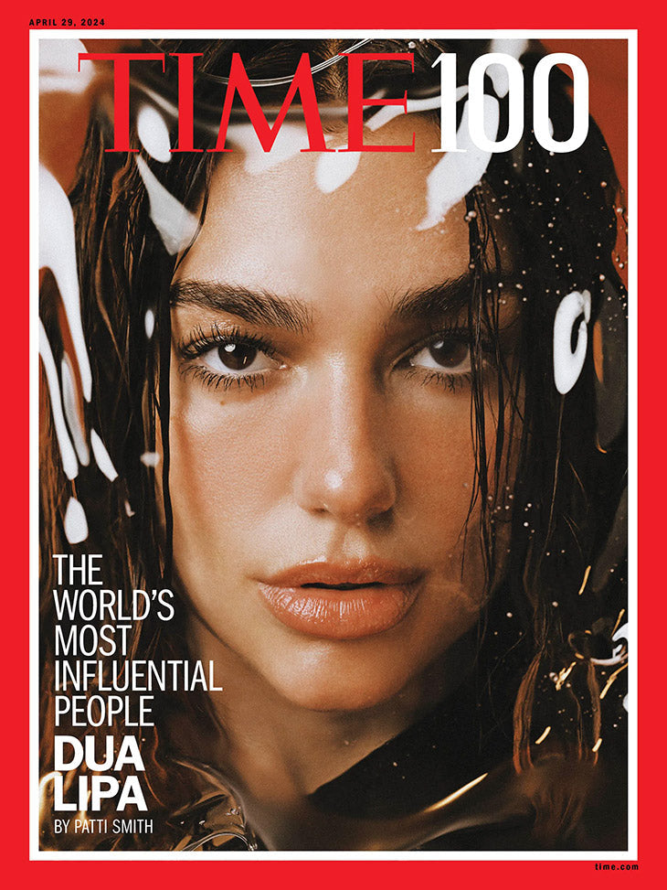 Dua Lipa featured on the cover of Time Magazine, showcasing her vibrant portrait and stylish look.