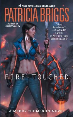Paperback of "Fire Touched" by Ace Books featuring the book cover with fiery artwork and title text.