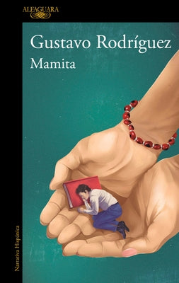 Paperback book titled "Mamita / Mommy" by Alfaguara, featuring a cover with colorful artwork and the title prominently displayed.