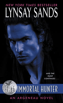 Paperback copy of The Immortal Hunter by Avon Books, featuring the book's cover with dark fantasy artwork.