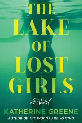 Paperback copy of "The Lake of Lost Girls" by Crooked Lane Books, showing the book cover with dark, mysterious artwork.