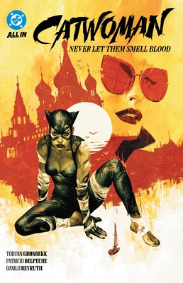 Paperback DC Comics Catwoman Vol. 2: Never Let Them Smell Blood featuring Catwoman in a dynamic pose and comic book cover art.