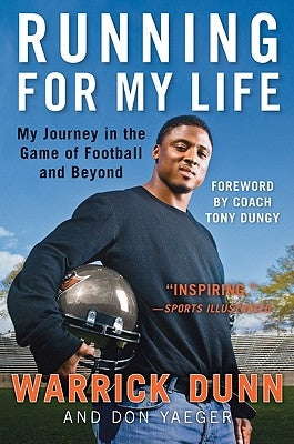Paperback book titled "Running for My Life" by Dey Street Books, featuring a cover image with football-themed design.