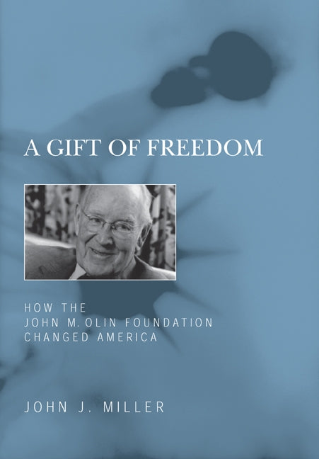 Paperback book titled "A Gift of Freedom" by Encounter Books, exploring how the John M. Olin Foundation influenced America.