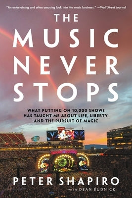 Paperback book titled "The Music Never Stops" by Hachette Books, featuring a cover with musical and life-themed artwork.