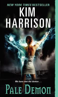 Paperback copy of Pale Demon by Harper Voyager featuring the book's cover art with dark fantasy illustrations.